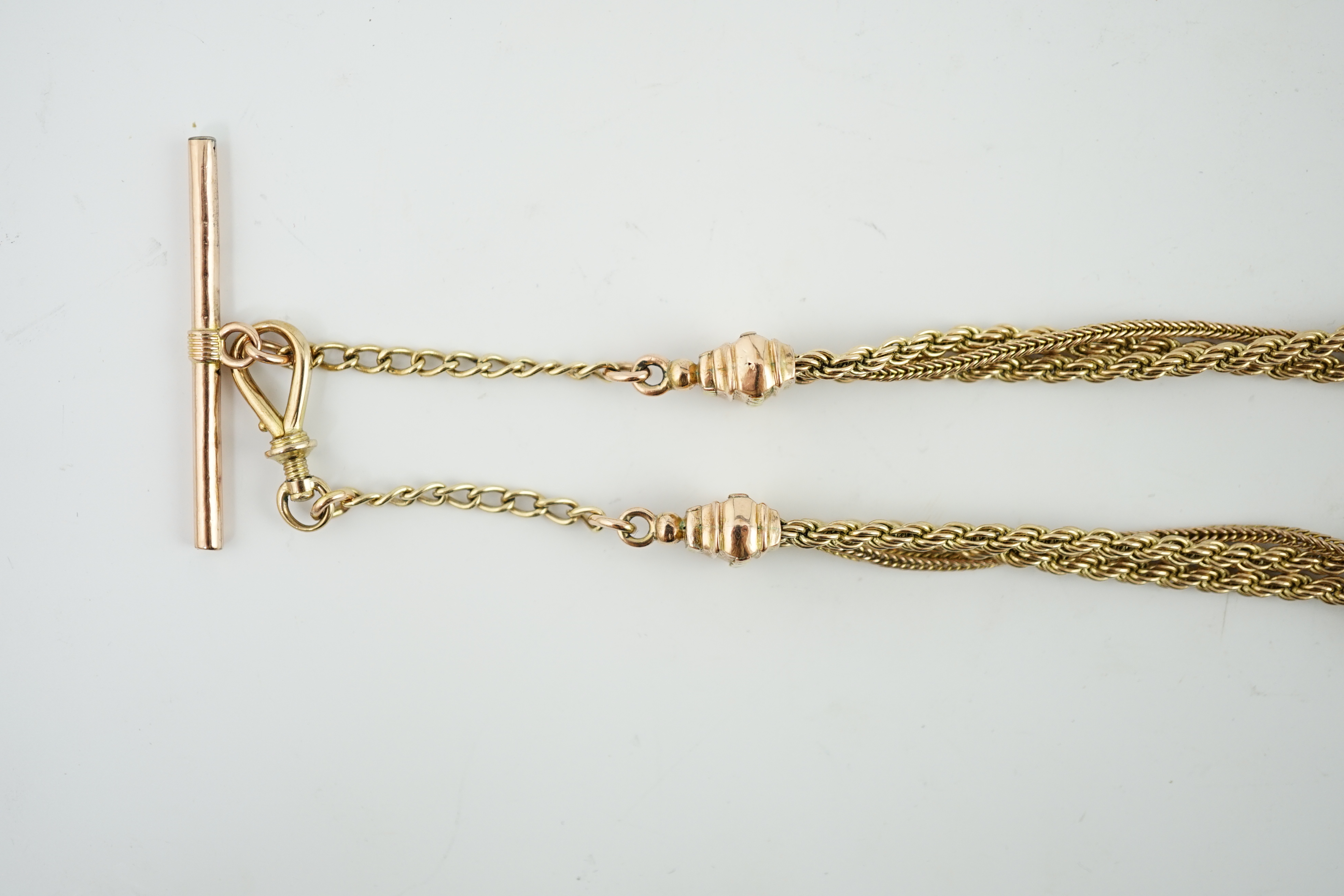 A Victorian two colour gold triple strand Albertina